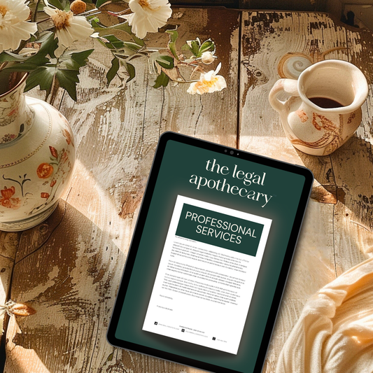 mockup of a professional services agreement on an ipad, which sits on a wooden table with a coffee cup and flowers